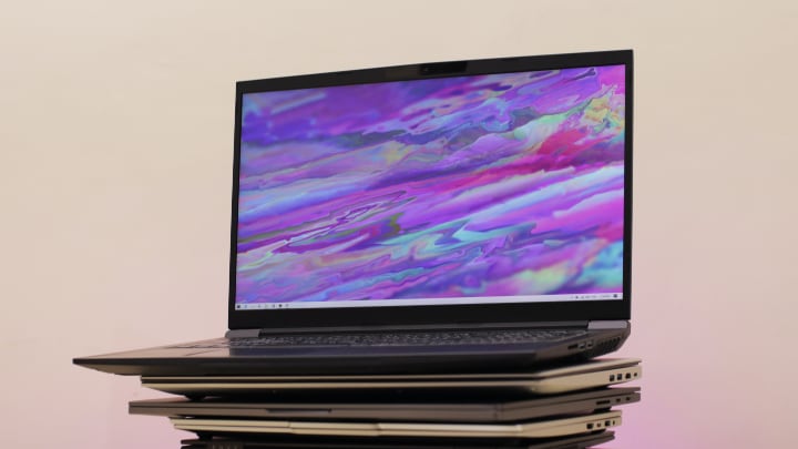 Open laptop on top of stack of laptops